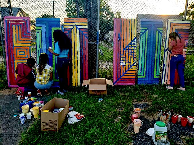 Children working on a community art piece